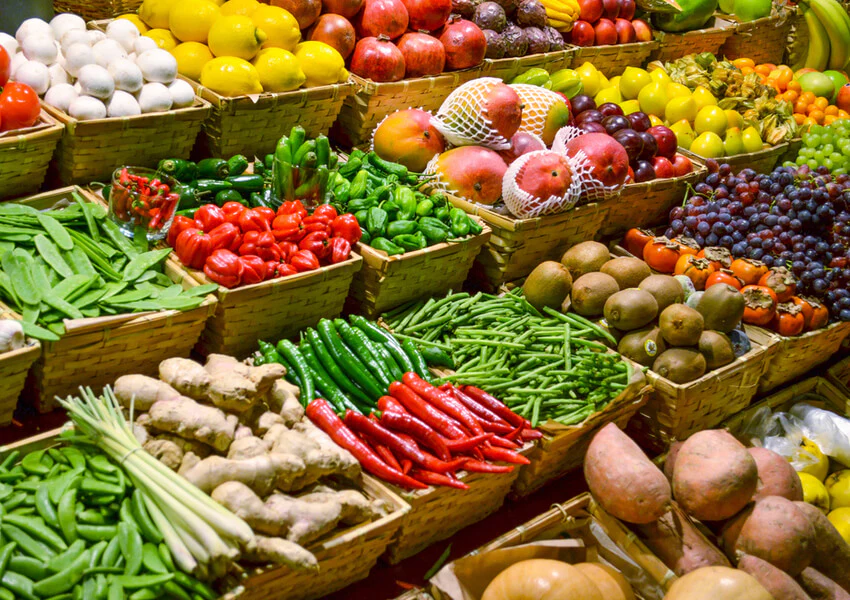 Fresh produce at Bayshore Market with seasonal fruits vegetables and greens